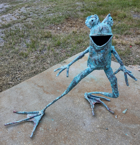 Small frog, leg extended, happy face