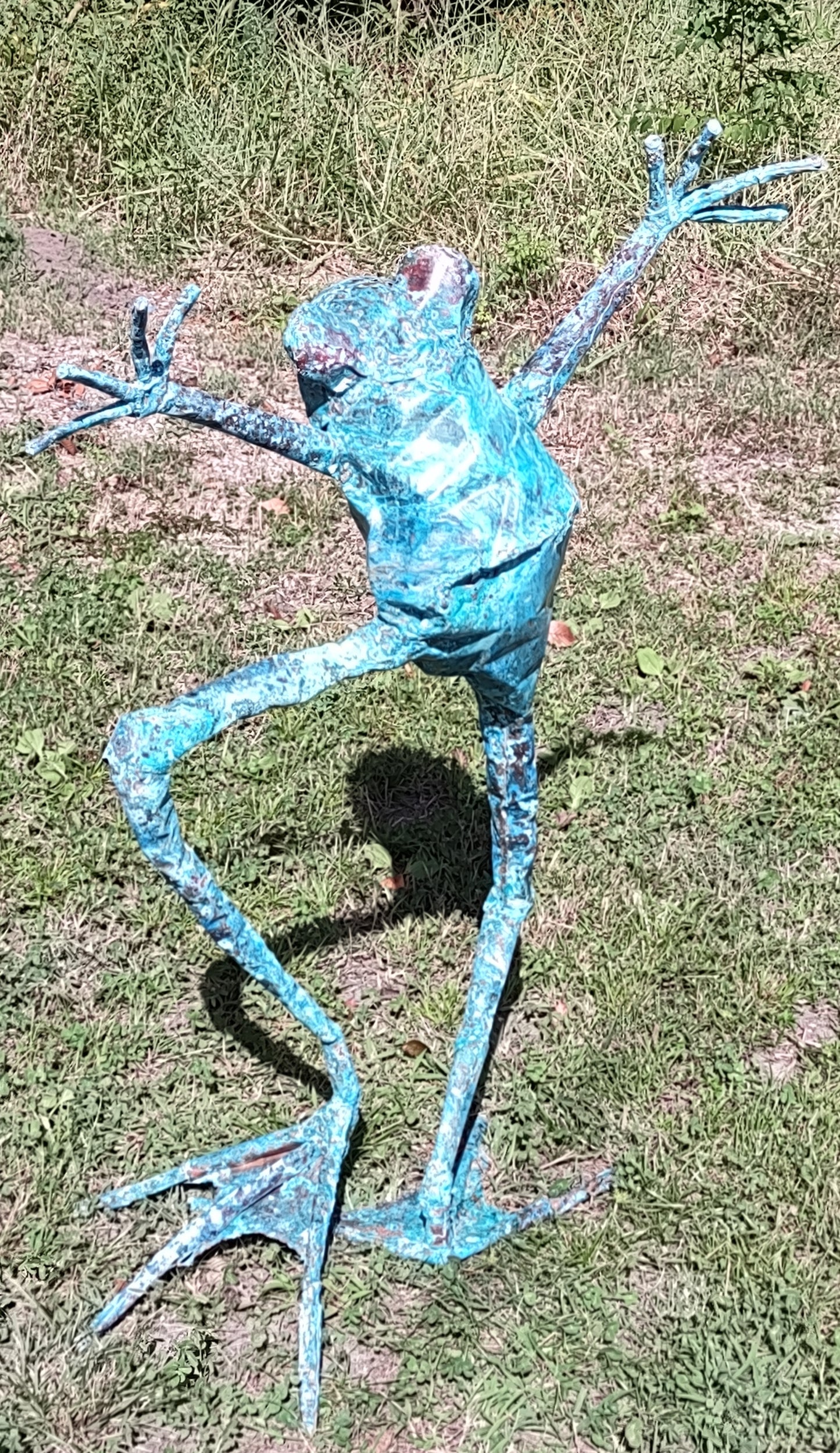 Dancer frog with fingers outstretched