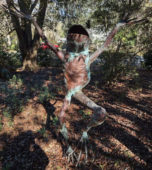 Leaping adult human-sized copper frog sculpture