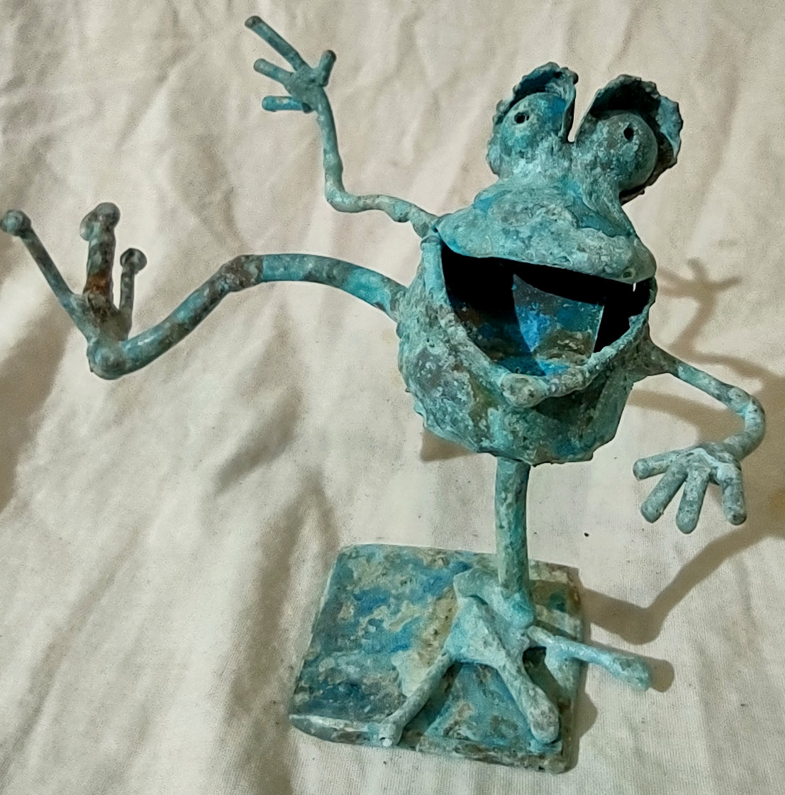 dancing copper frog, leg extended #1