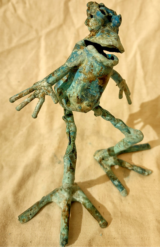 whimsical copper frog sculpture, looking to one side froglette