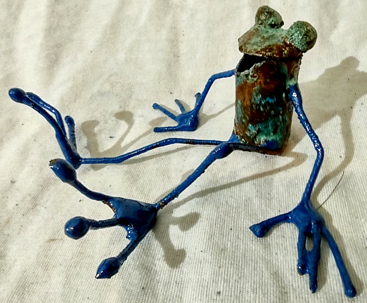 tiny seated frog sculpture